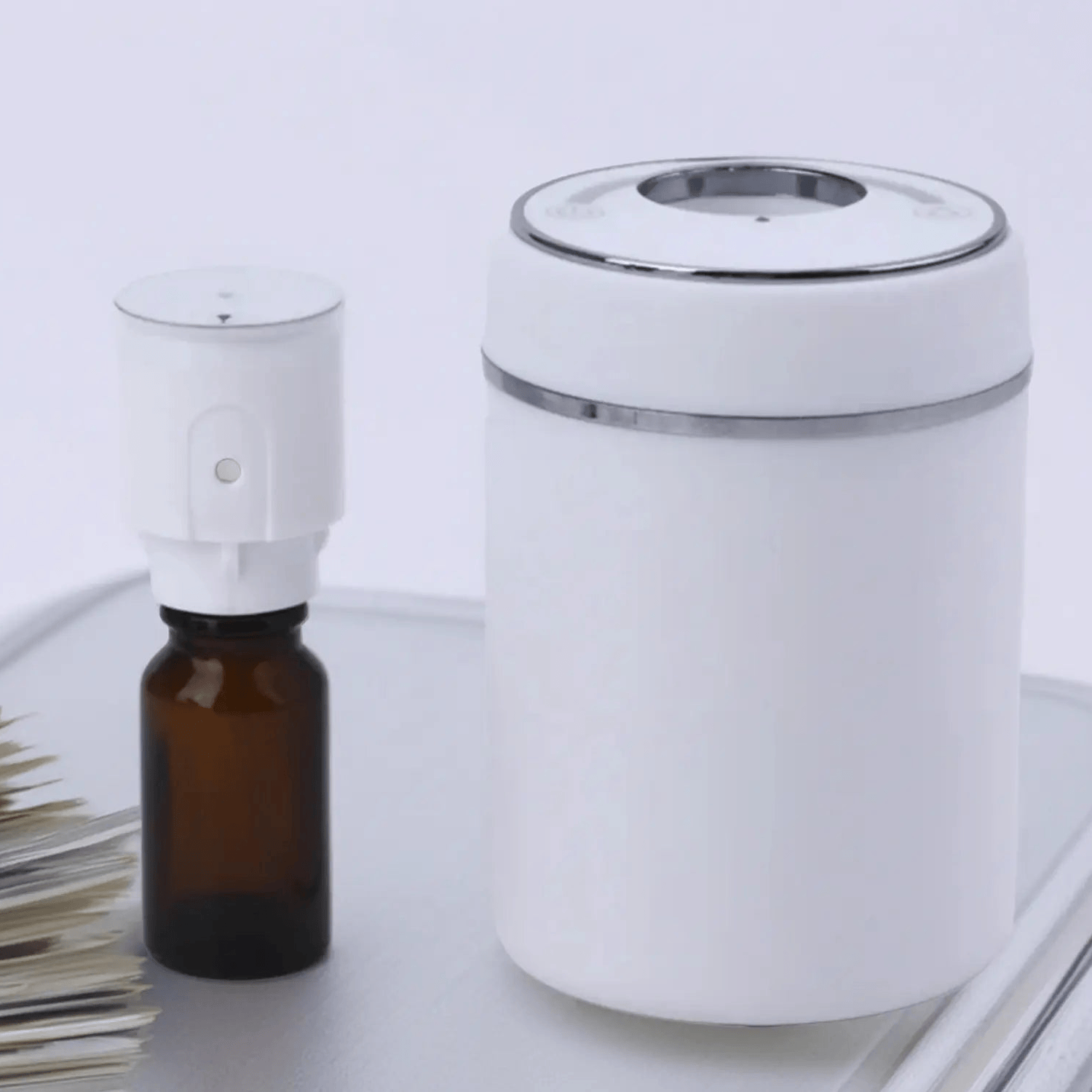 White Mini Electric Scent Diffuser showing the inside vessel to fill with purple duck room spray 