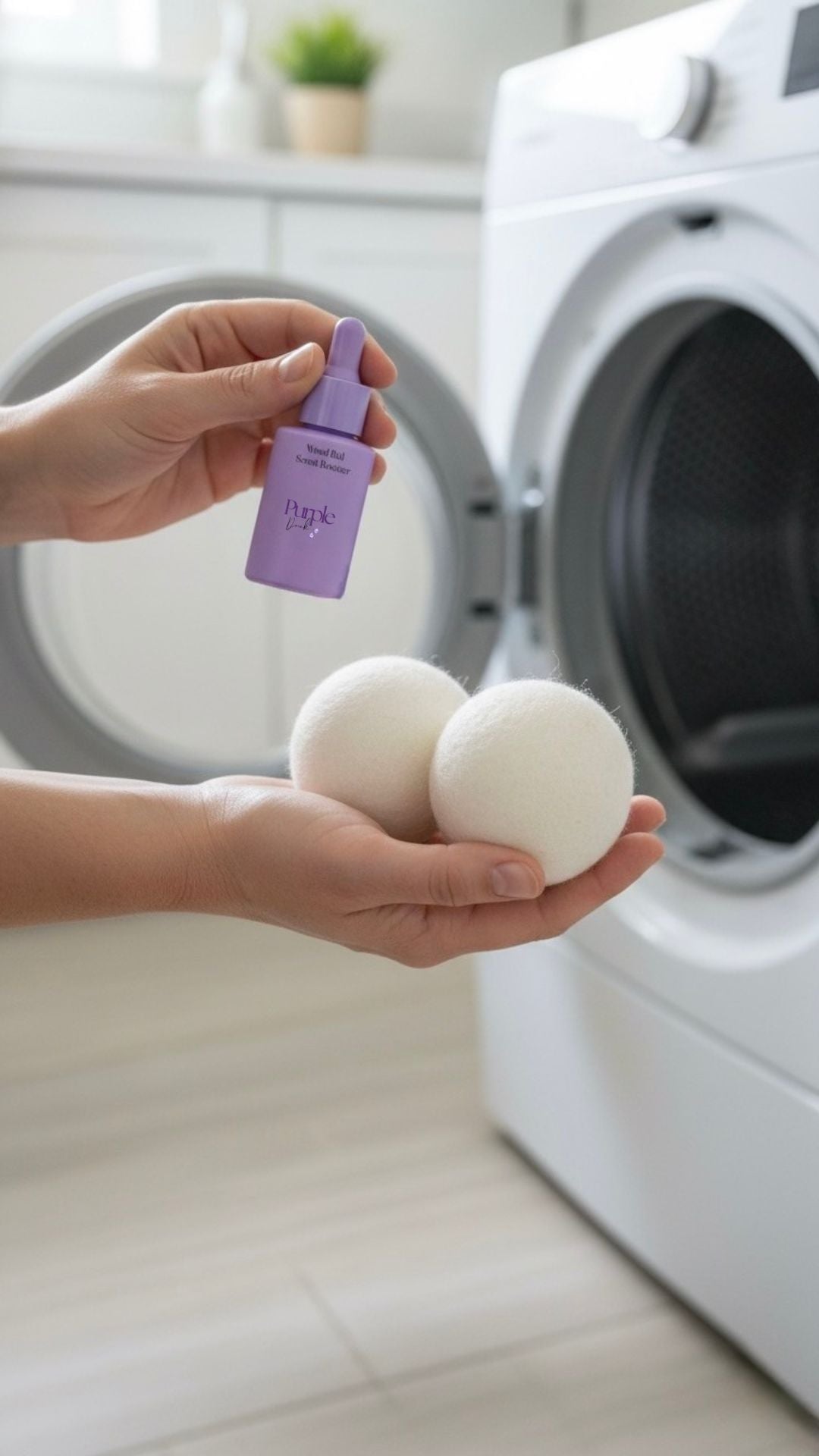 Person holding laundry scent booster and dryer balls in front of a dryer.
