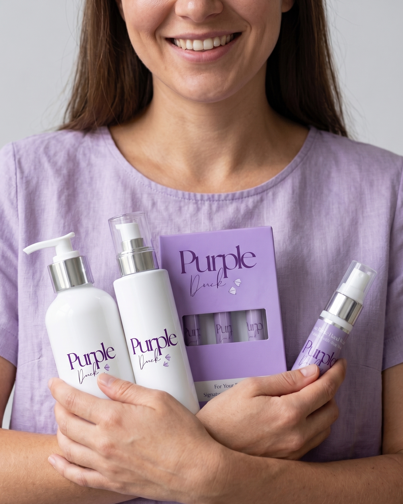 Woman holding a bunch of purple duck womens products